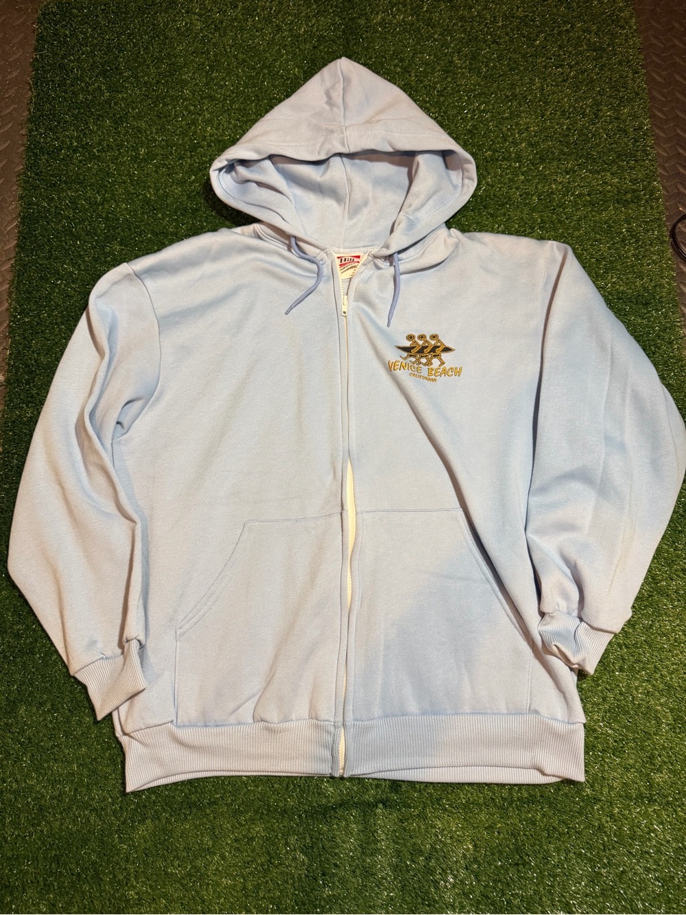 Light Blue Zip-Up Hoodie with Chest Logo